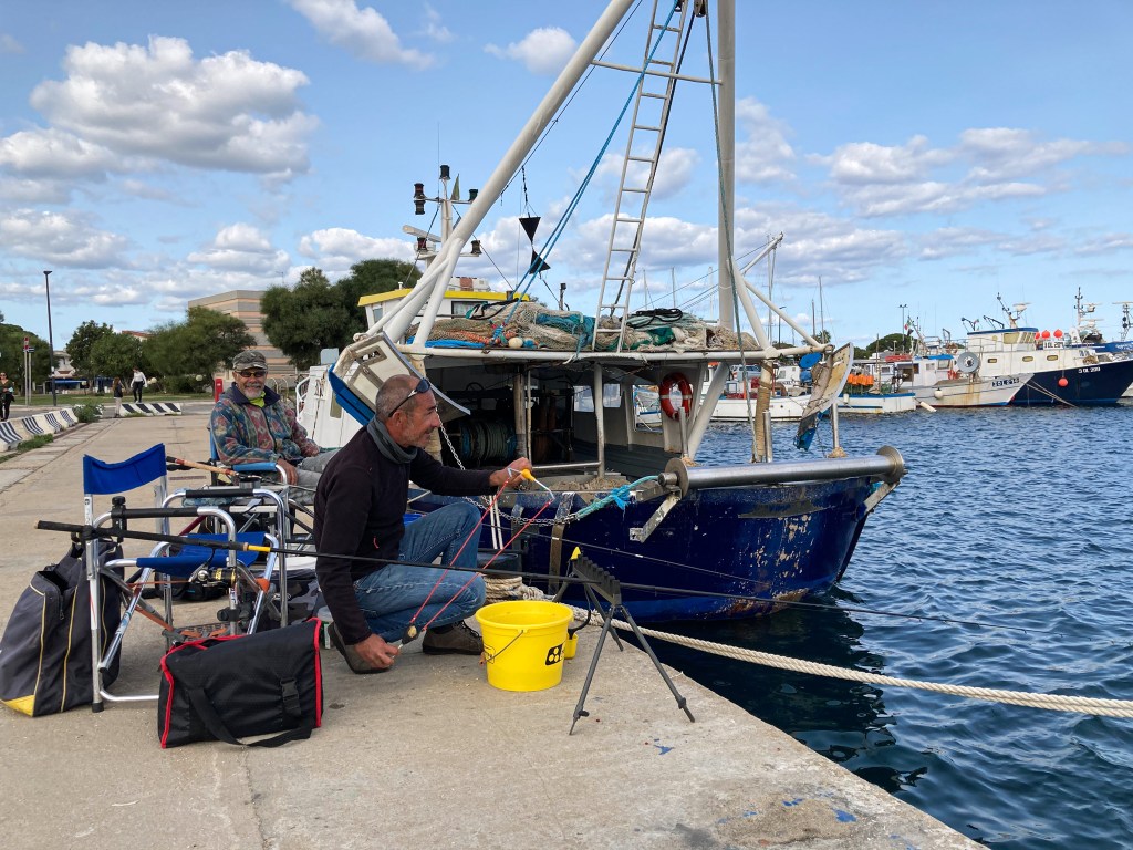 Fischer im Hafen von La Caletta